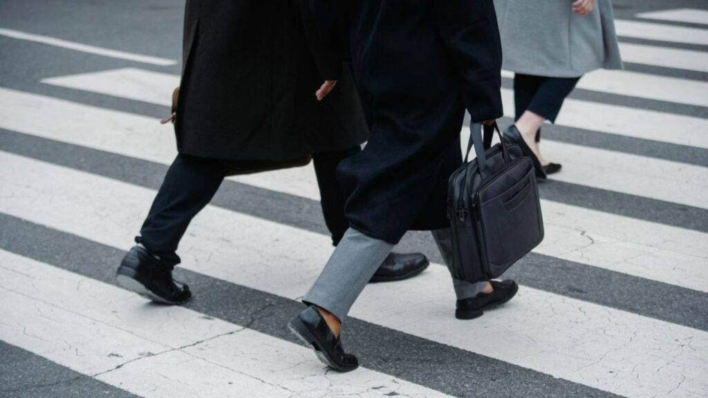 Office workers commuting through a downtown business district.