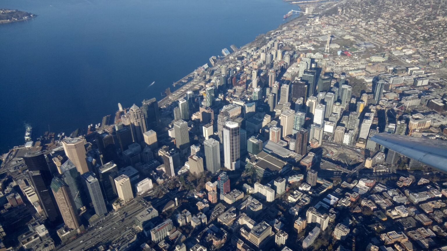 Aerial view of downtown Seattle's office towers along Elliott Bay.
